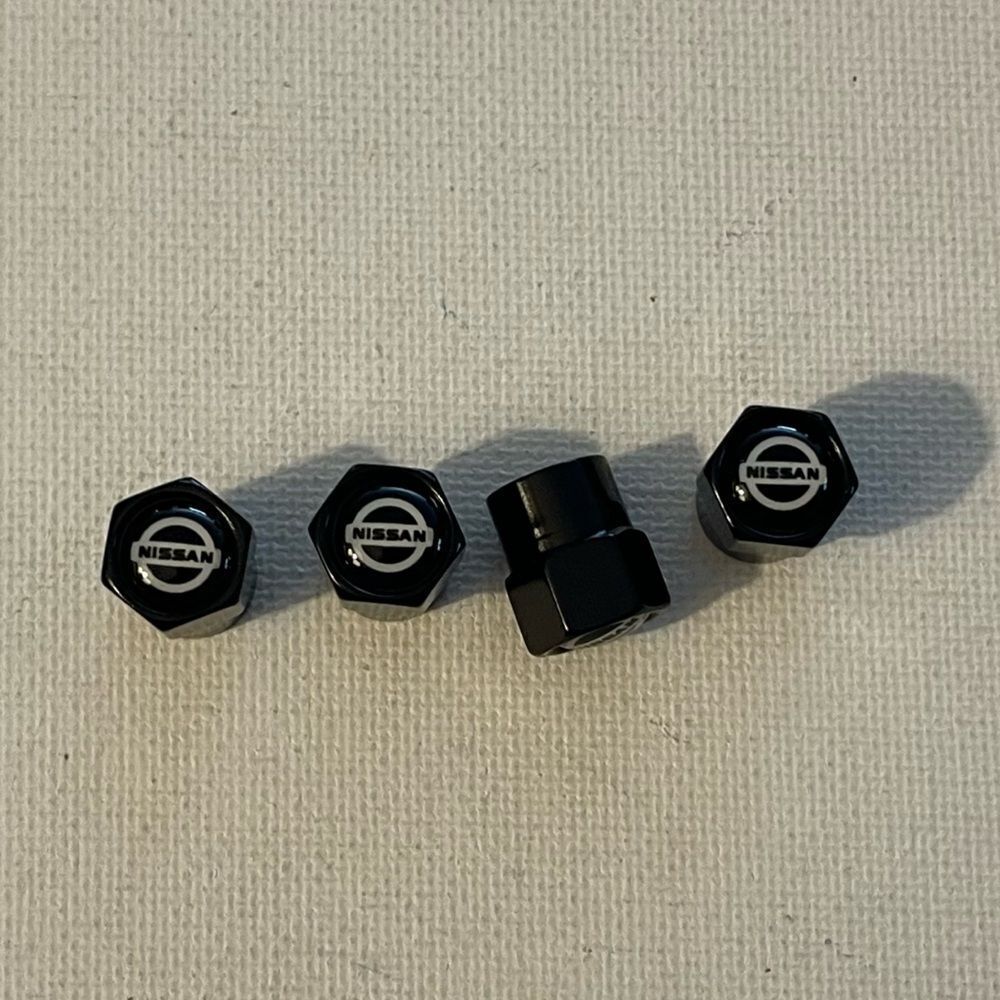 Nissan Logo Valve Stem caps in Black set of 4 NWT